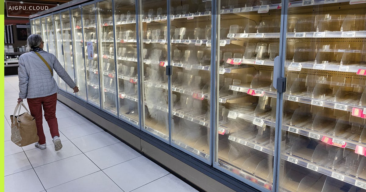 Empty refrigerated shelves in a European supermarket after a cyberattack disabled cooling systems