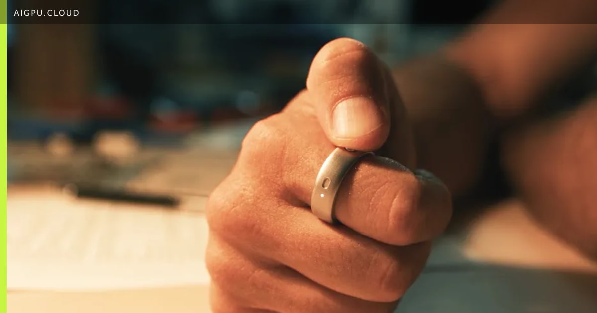 Natura Interface smart ring on a finger showing AI agent activation